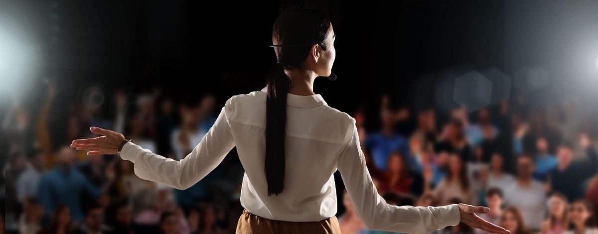 Professional woman leading an event.